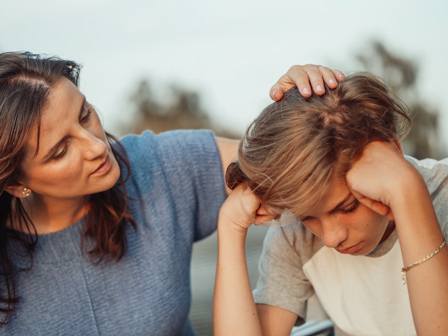 mom talking to teenager son | The Peaceful Mind Counseling Center 