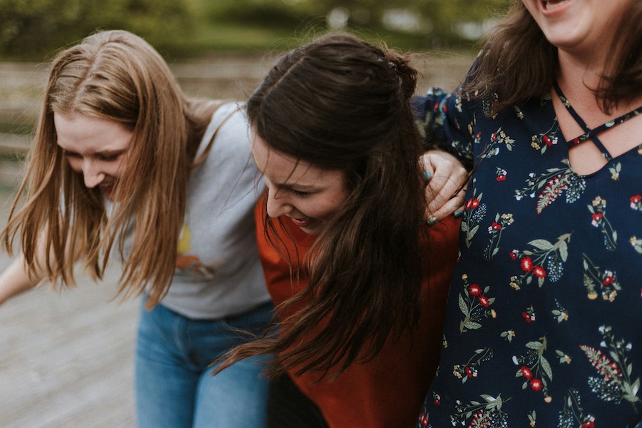 three teenage female friends laughing | The Peaceful Mind Counseling Center