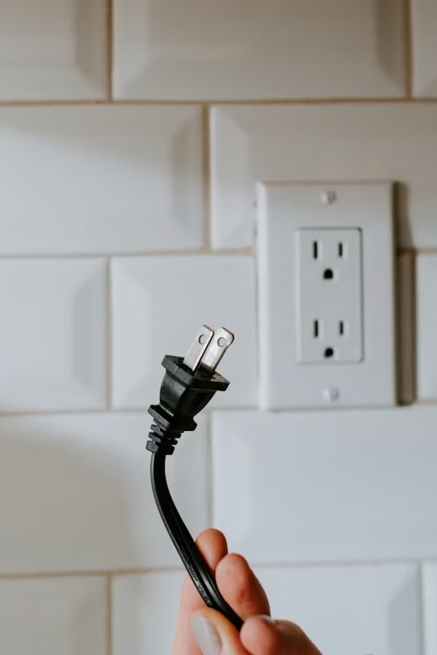 a plug being removed to represent unplugging after work | The Peaceful Mind Counseling Center